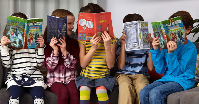 Kids reading books and smiling